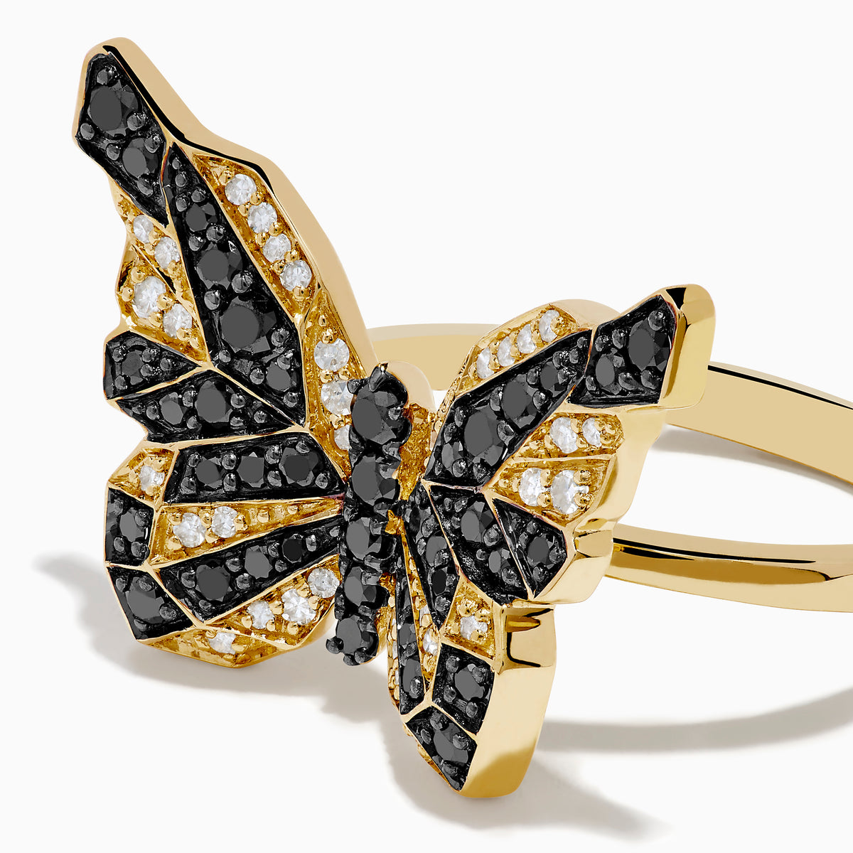 The Safari 14K Yellow Gold Black & White Diamond Butterfly Ring features a butterfly design with black and white diamonds segmented on its wings, set against a white background.