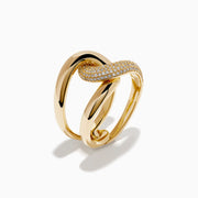 The D'Oro 14K Yellow Gold Diamond Interlocking Ring features a knot design, with one section accented by sparkling diamonds, beautifully displayed against a white background.