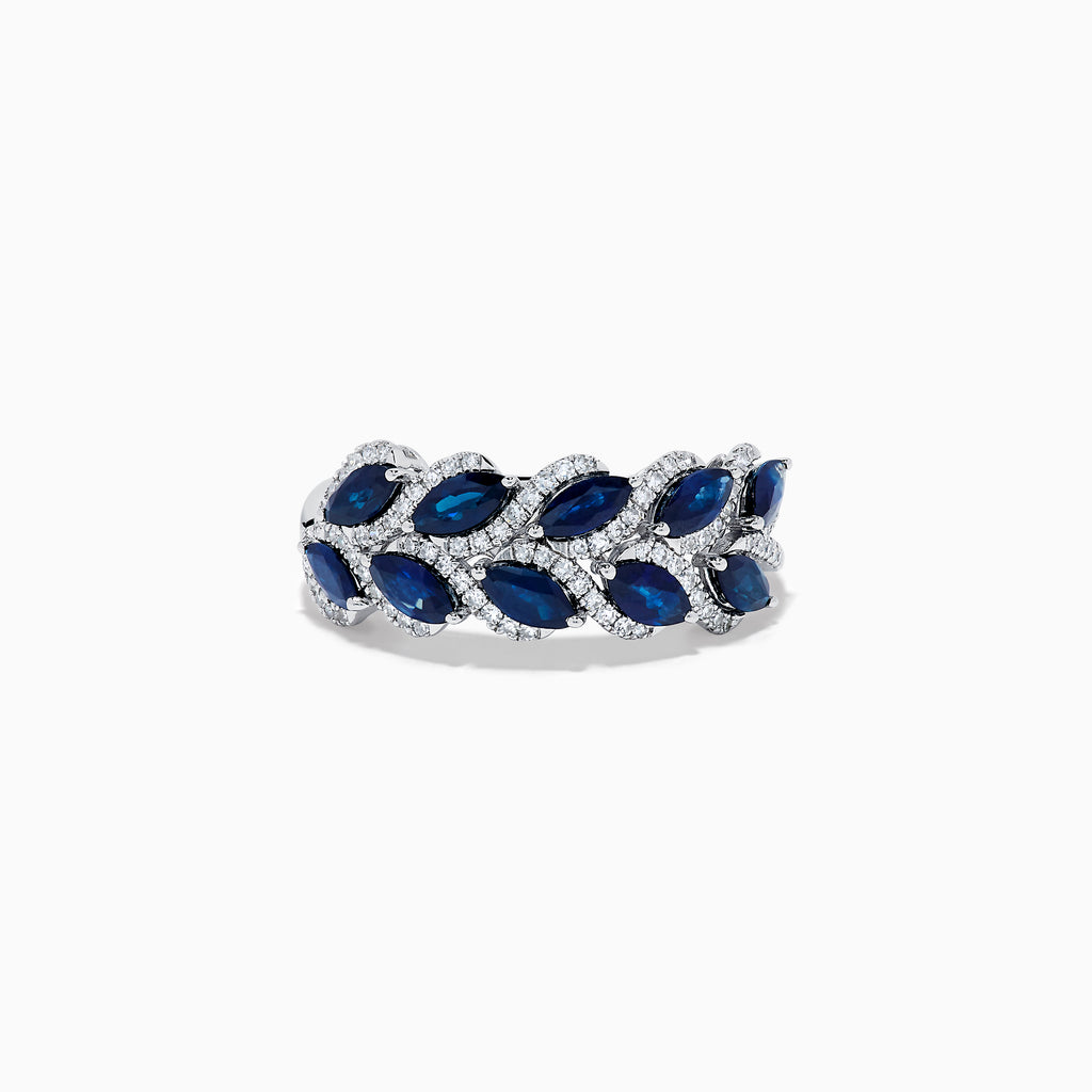 The 14K White Gold Sapphire and Diamond Leaf Motif Ring features alternating marquise-shaped blue sapphires and small round diamonds arranged in a woven, leaf-like design.