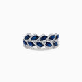 The 14K White Gold Sapphire and Diamond Leaf Motif Ring features alternating marquise-shaped blue sapphires and small round diamonds arranged in a woven, leaf-like design.