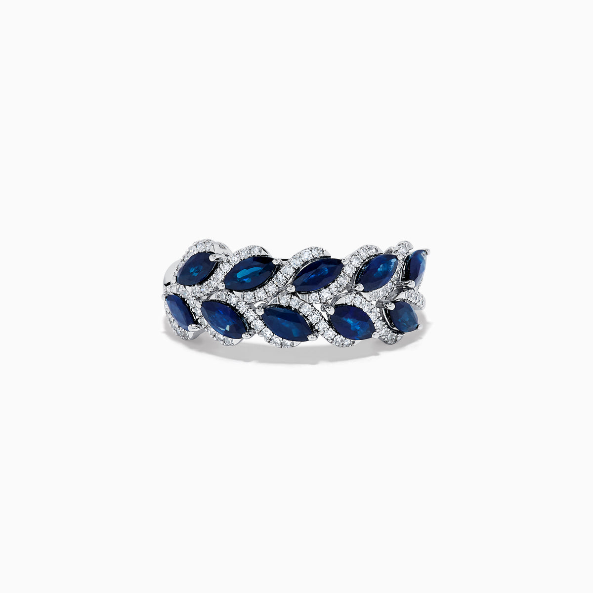 The 14K White Gold Sapphire and Diamond Leaf Motif Ring features alternating marquise-shaped blue sapphires and small round diamonds arranged in a woven, leaf-like design.