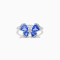 The Nahla Siri 14K White Gold Tanzanite and Diamond Butterfly Ring features four tanzanite blue wings with sparkling diamond outlines, set against a white background.