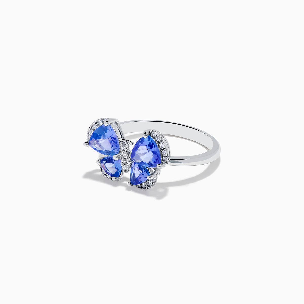The Nahla Siri 14K White Gold Tanzanite and Diamond Butterfly Ring features four tanzanite blue wings with sparkling diamond outlines, set against a white background.