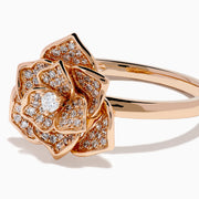 The Pave Rose 14K Rose Gold Diamond Rose Ring features a detailed floral design with multiple small diamonds forming the petals and center, all set against a white background.