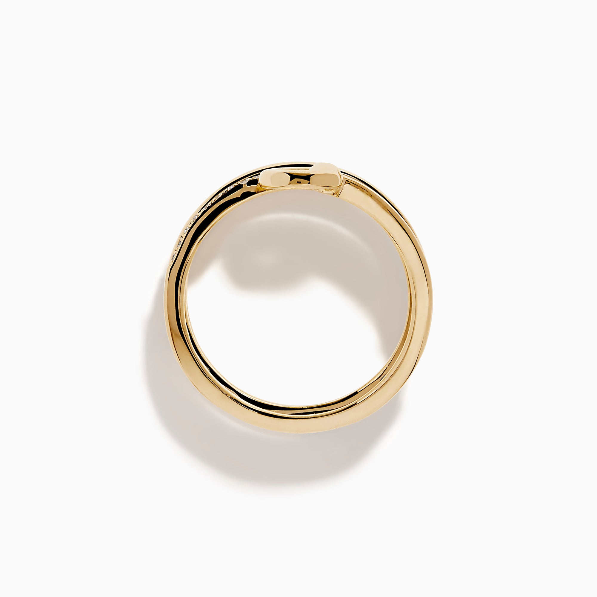 The D'Oro 14K Yellow Gold Spiral Diamond Ring features three bands, two adorned with sparkling diamonds. The top band forms a graceful circular loop, offering an elegant and modern touch.