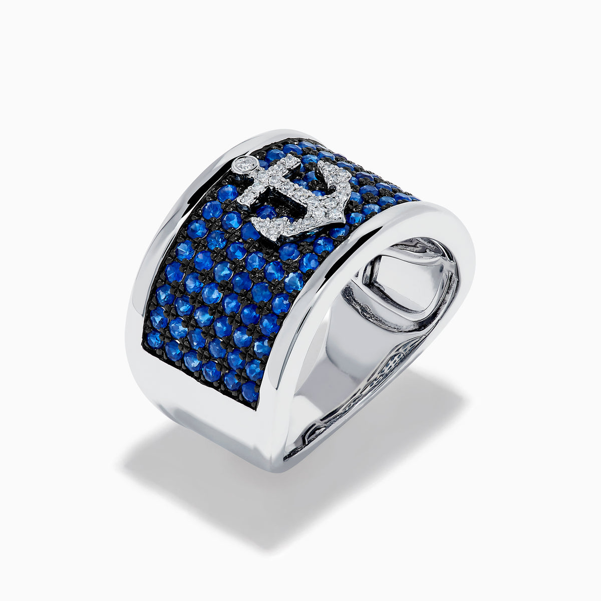 The Sterling Silver Blue Sapphire and Diamond Anchor Ring showcases a striking anchor center in clear stones, set on a white background with blue sapphires for added elegance.