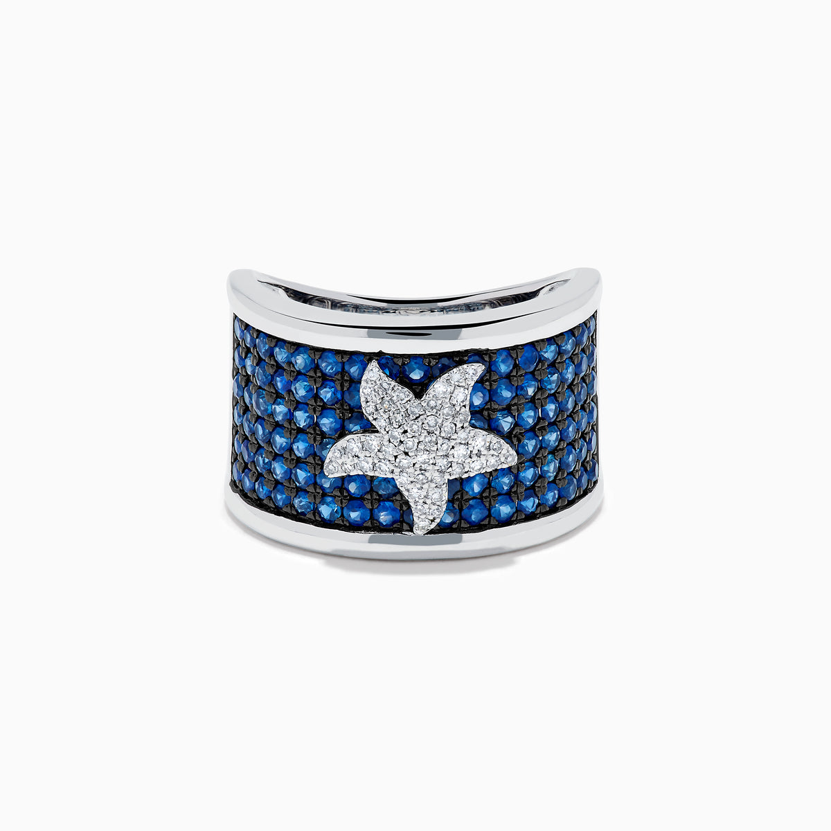 The Sterling Silver Blue Sapphire and Diamond Starfish Ring features a white starfish with clear crystals set among round blue sapphires atop a wide, curved band for a unique and stylish look.