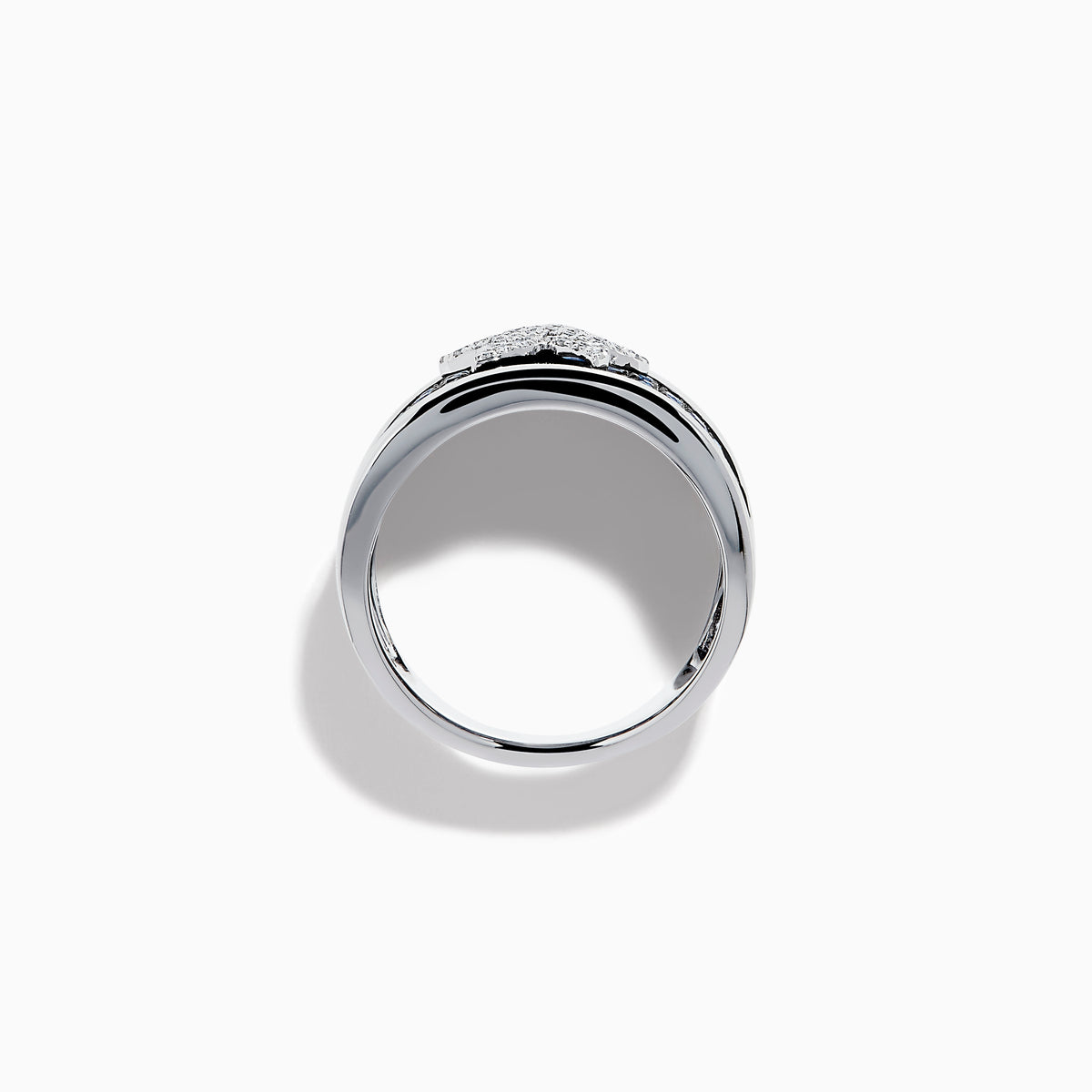 The Sterling Silver Blue Sapphire and Diamond Starfish Ring features a white starfish with clear crystals set among round blue sapphires atop a wide, curved band for a unique and stylish look.
