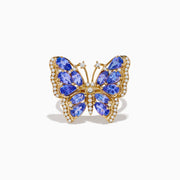 The Nahla 14K Yellow Gold Tanzanite and Diamond Butterfly Ring features blue tanzanite wings and diamond accents on the edges and body, shown against a white background.