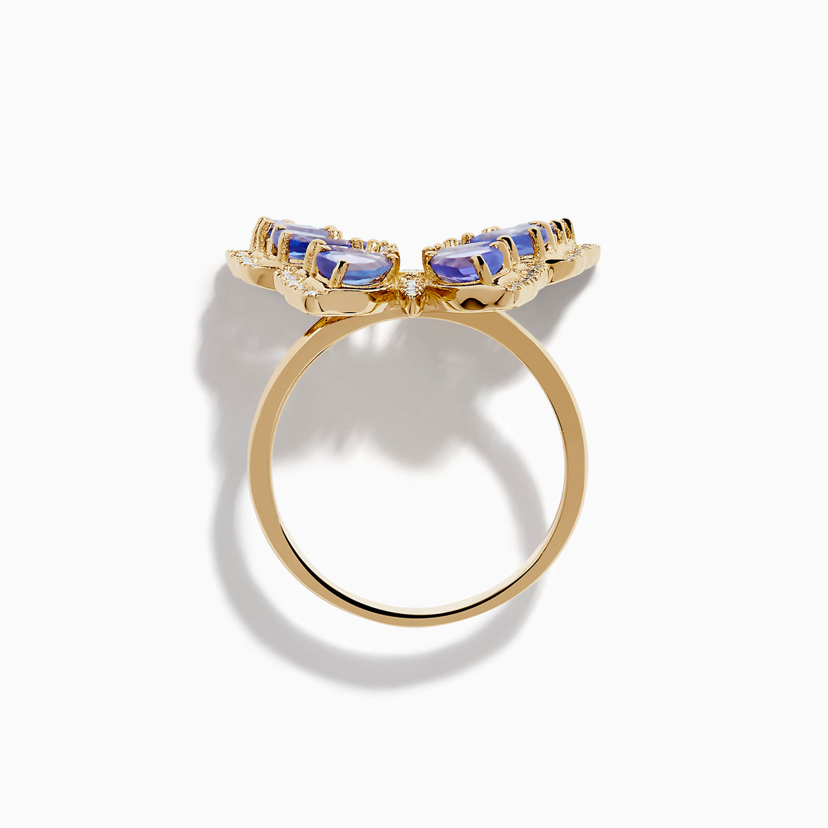 The Nahla 14K Yellow Gold Tanzanite and Diamond Butterfly Ring features blue tanzanite wings and diamond accents on the edges and body, shown against a white background.