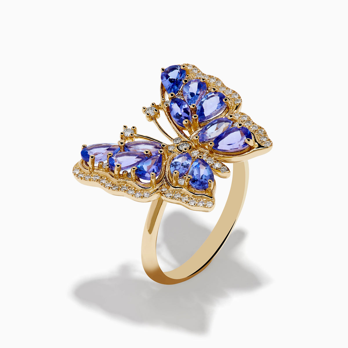 The Nahla 14K Yellow Gold Tanzanite and Diamond Butterfly Ring features blue tanzanite wings and diamond accents on the edges and body, shown against a white background.