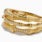 The 14K Yellow Gold Diamond Bamboo Multi Row Ring features two bamboo-inspired bands set with central rows of white diamonds, stacked together for a striking modern twist on the classic diamond ring.