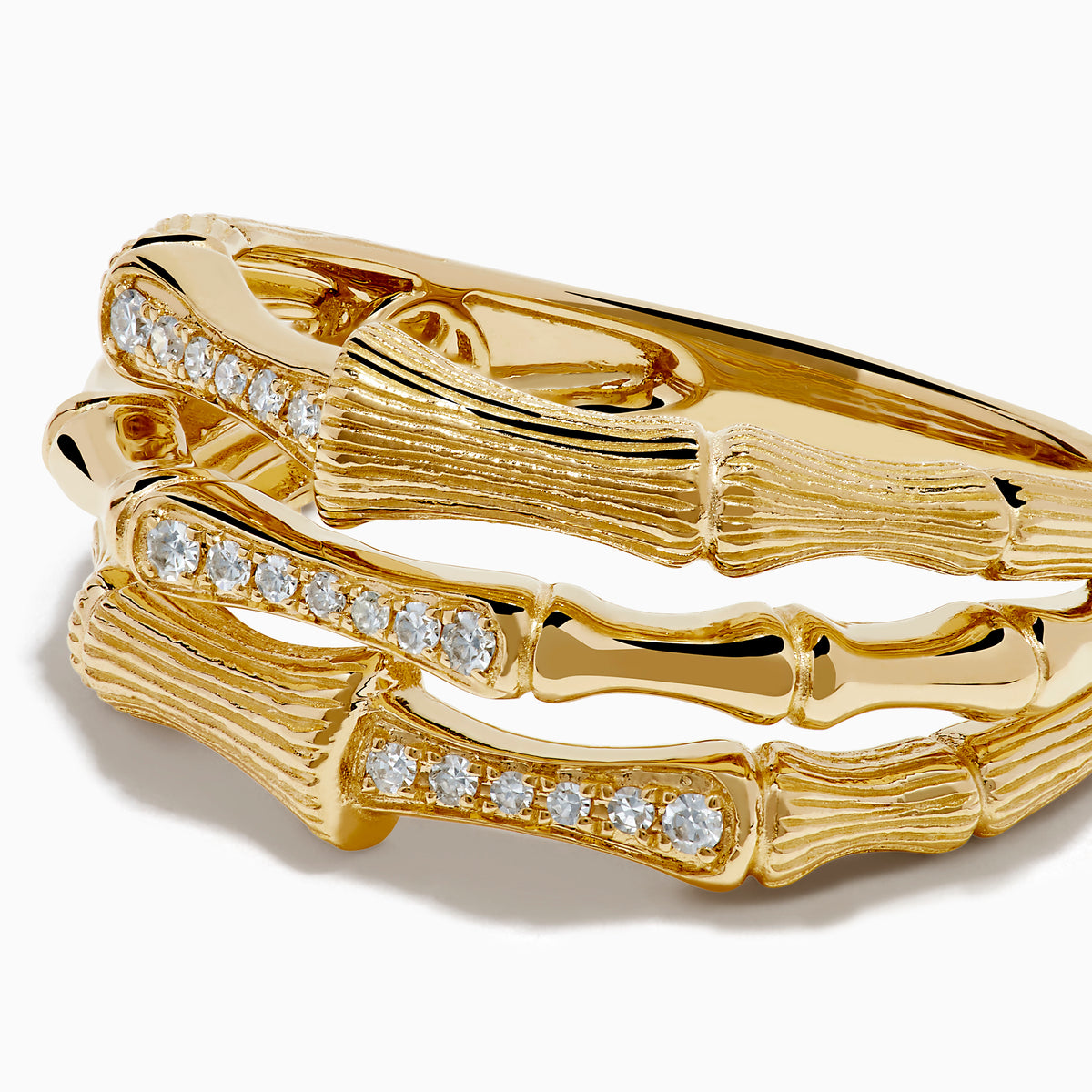 The 14K Yellow Gold Diamond Bamboo Multi Row Ring features two bamboo-inspired bands set with central rows of white diamonds, stacked together for a striking modern twist on the classic diamond ring.
