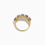 The 14K Yellow Gold Tanzanite and Diamond Halo Band showcases five rectangular tanzanites, each framed by a sparkling diamond halo, creating an elegant continuous design.