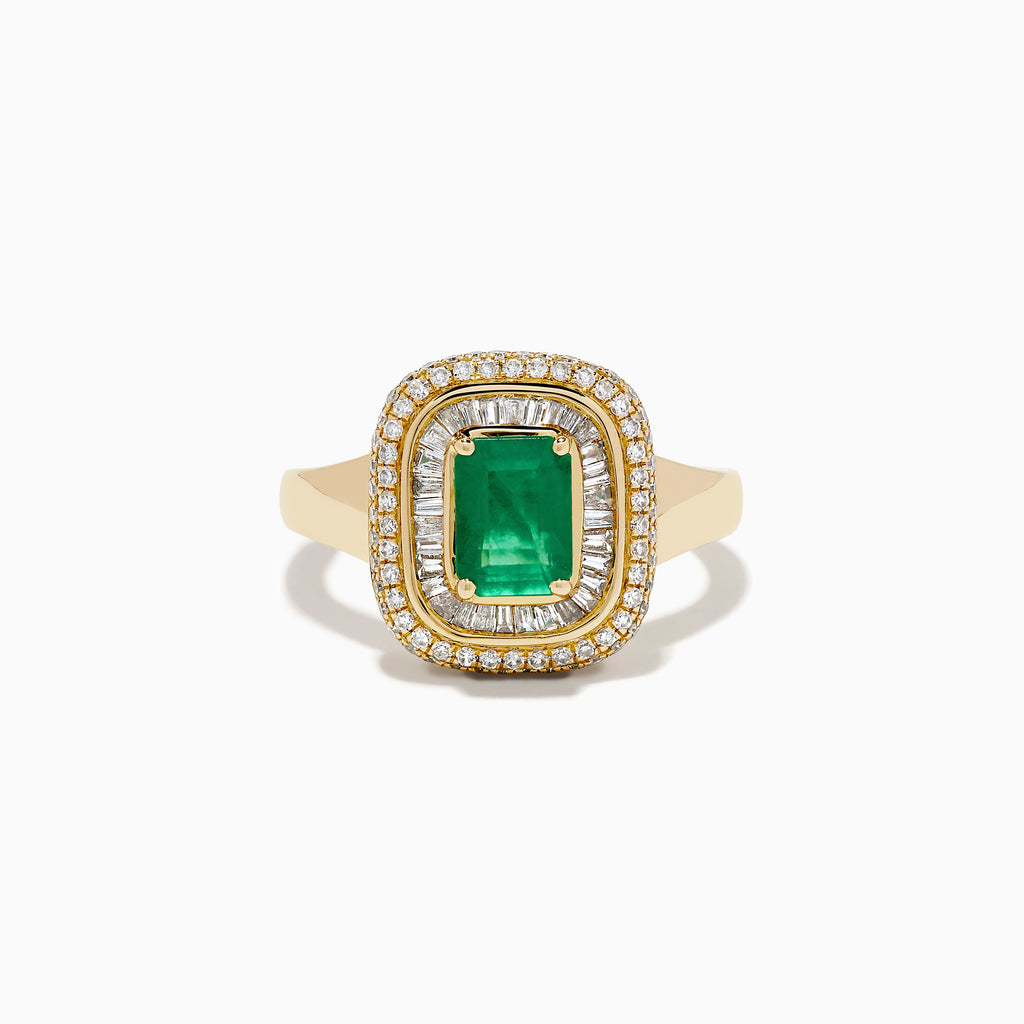 The 14K Yellow Gold Emerald and Diamond Double Halo Ring features an emerald-cut green gemstone at the center, framed by two rows of round and baguette diamonds in a rectangular halo setting.