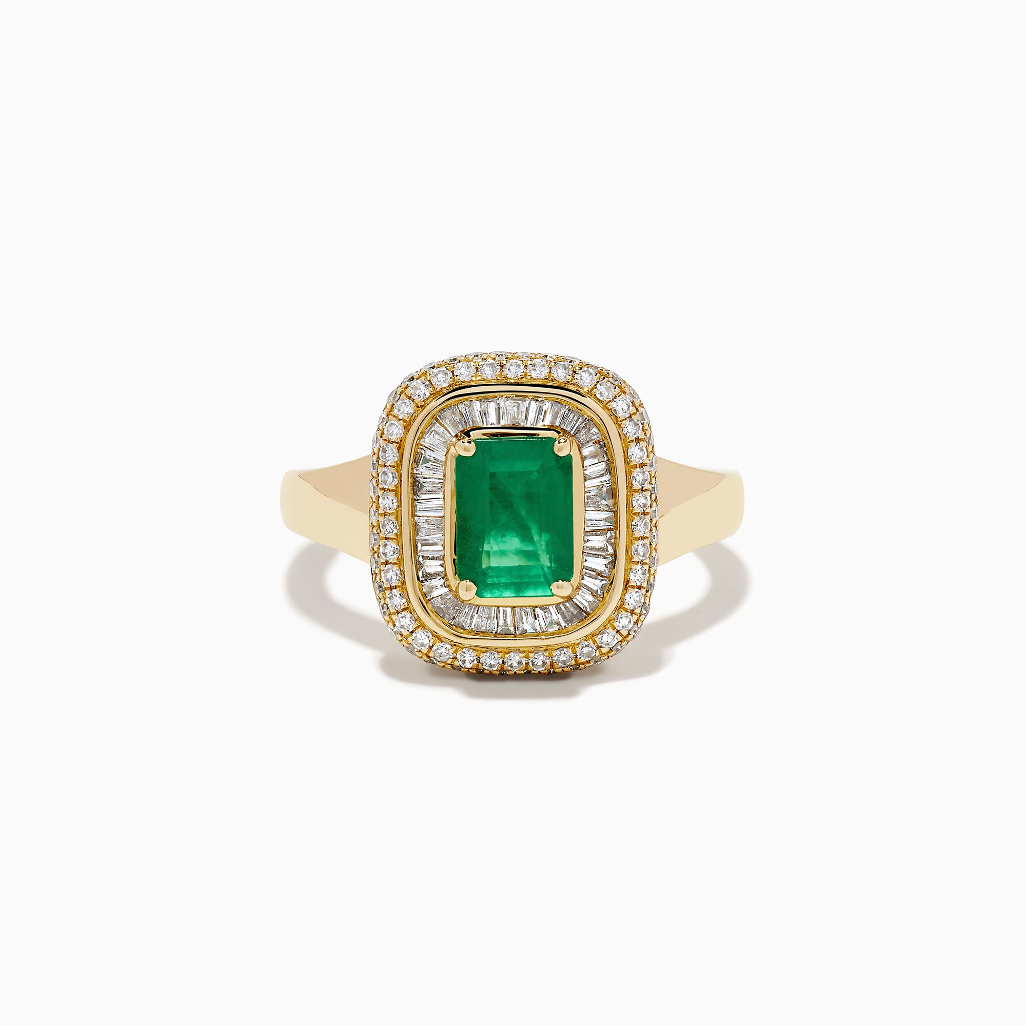 The 14K Yellow Gold Emerald and Diamond Double Halo Ring features an emerald-cut green gemstone at the center, framed by two rows of round and baguette diamonds in a rectangular halo setting.