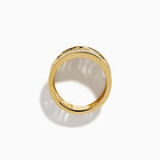 The D'Oro 14K Yellow Gold Geometric Diamond Ring features a wide band with intricate geometric patterns set with sparkling white diamonds, offering an ornate and luxurious look.