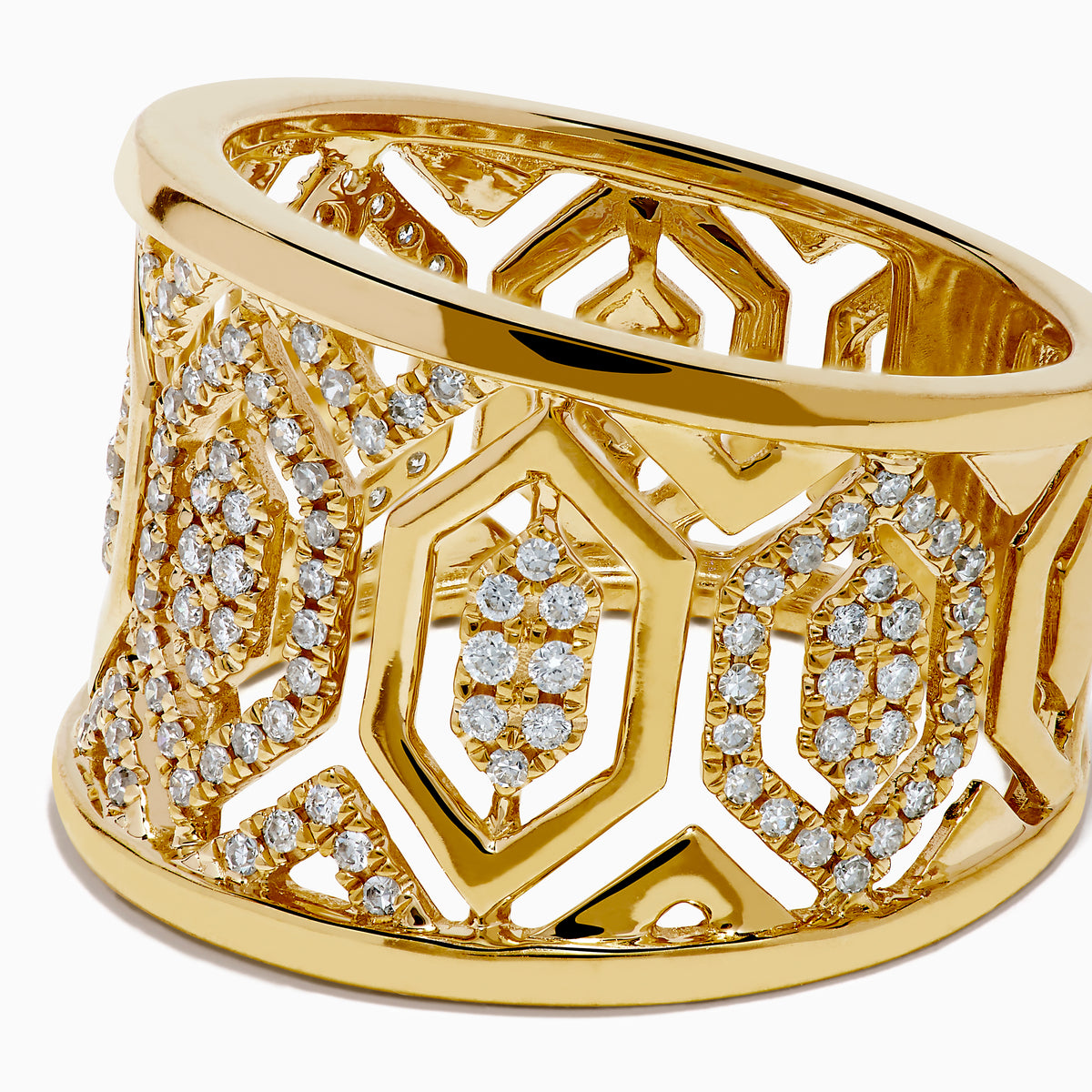 The D'Oro 14K Yellow Gold Geometric Diamond Ring features a wide band with intricate geometric patterns set with sparkling white diamonds, offering an ornate and luxurious look.
