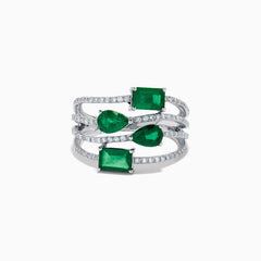 The 14K White Gold Emerald and Diamond Open Multi Row Ring showcases three bands set with diamonds and accented by large rectangular, square, and teardrop-shaped emeralds for a dazzling effect.