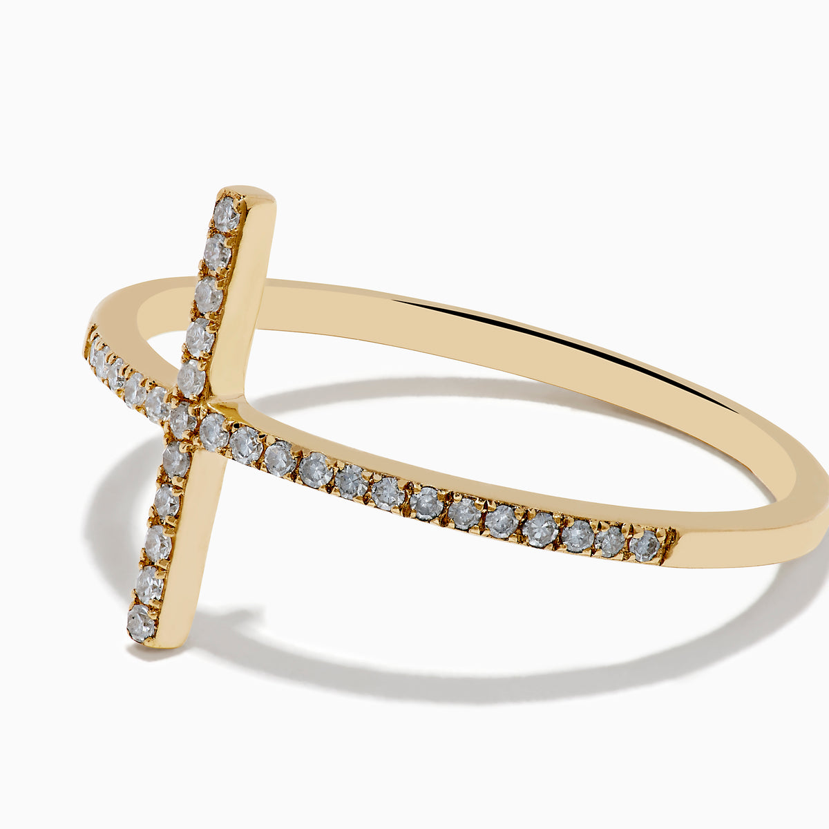 The Novelty 14K Yellow Gold Diamond Cross Ring features a large horizontal cross design set with small white diamonds, showcased on a plain white background. A stunning statement piece for any occasion.