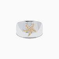 The Sterling Silver and 14K Yellow Gold Plated Diamond Starfish Ring showcases a gold-plated starfish adorned with sparkling white stones, set on a wide sterling silver band and displayed against a plain white background.