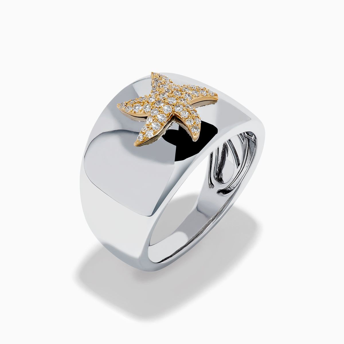 The Sterling Silver and 14K Yellow Gold Plated Diamond Starfish Ring showcases a gold-plated starfish adorned with sparkling white stones, set on a wide sterling silver band and displayed against a plain white background.