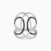 The 14K White Gold Black and White Diamond Intertwined Ring features interlocking ovals set with alternating rows of black and white diamonds, displayed on a plain white background.