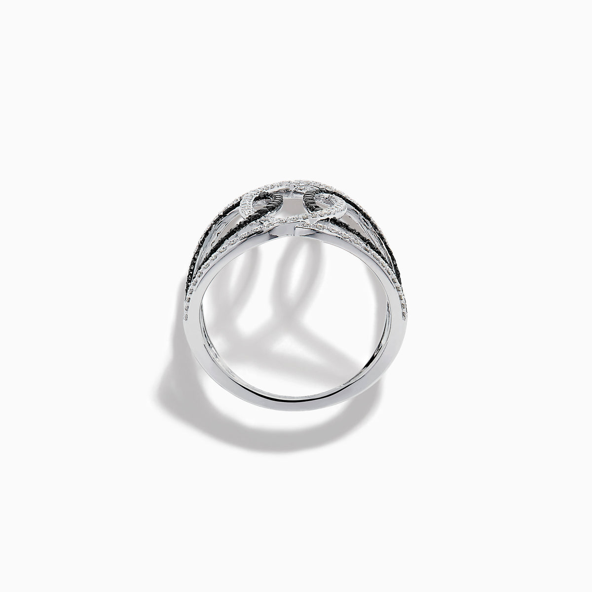 The 14K White Gold Black and White Diamond Intertwined Ring features interlocking ovals set with alternating rows of black and white diamonds, displayed on a plain white background.