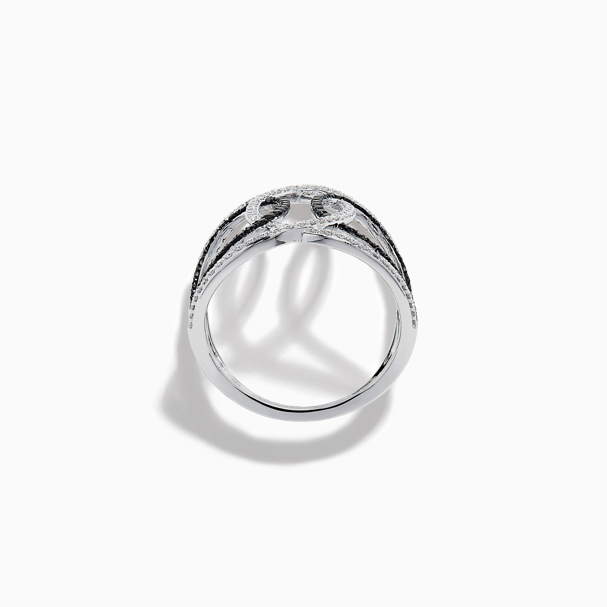 The 14K White Gold Black and White Diamond Intertwined Ring features interlocking ovals set with alternating rows of black and white diamonds, displayed on a plain white background.