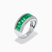 The 14K White Gold Emerald Baguette and Diamond Pavé Ring showcases a central row of emerald baguettes, flanked by rows of sparkling pavé diamonds on both sides.