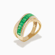 The 14K Yellow Gold Emerald and Diamond Crossover Ring features a central row of rectangular emeralds bordered by rows of sparkling white diamonds in an elegant crisscross design.