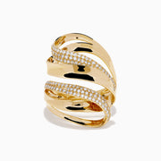 The 14K Yellow Gold Diamond Sculptural Ribbon Statement Ring features overlapping polished and diamond-encrusted bands, creating a dazzling, sculptural look.