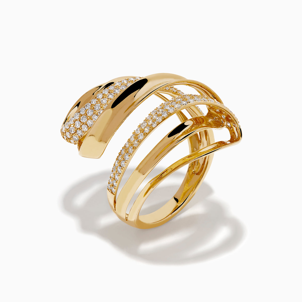 The 14K Yellow Gold Diamond Sculptural Ribbon Statement Ring features overlapping polished and diamond-encrusted bands, creating a dazzling, sculptural look.
