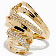 The 14K Yellow Gold Diamond Sculptural Ribbon Statement Ring features overlapping polished and diamond-encrusted bands, creating a dazzling, sculptural look.