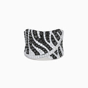 The 14K White Gold Black and White Diamond Zebra Print Ring features a wide, curved band with a striking black and white diamond stripe pattern set in sparkling white gold.