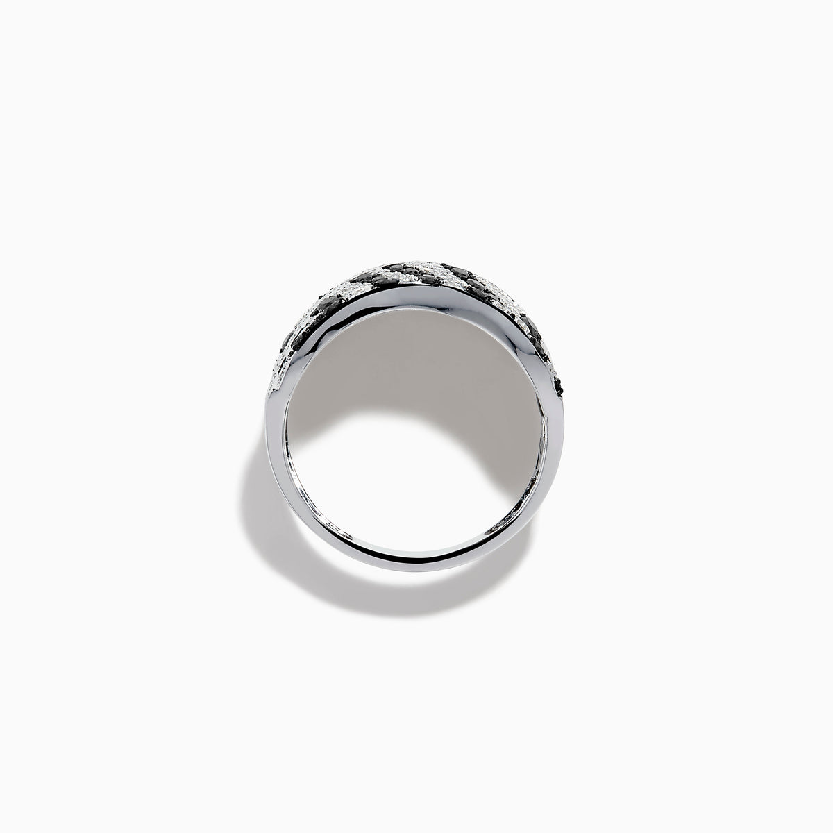 The 14K White Gold Black and White Diamond Zebra Print Ring features a wide, curved band with a striking black and white diamond stripe pattern set in sparkling white gold.