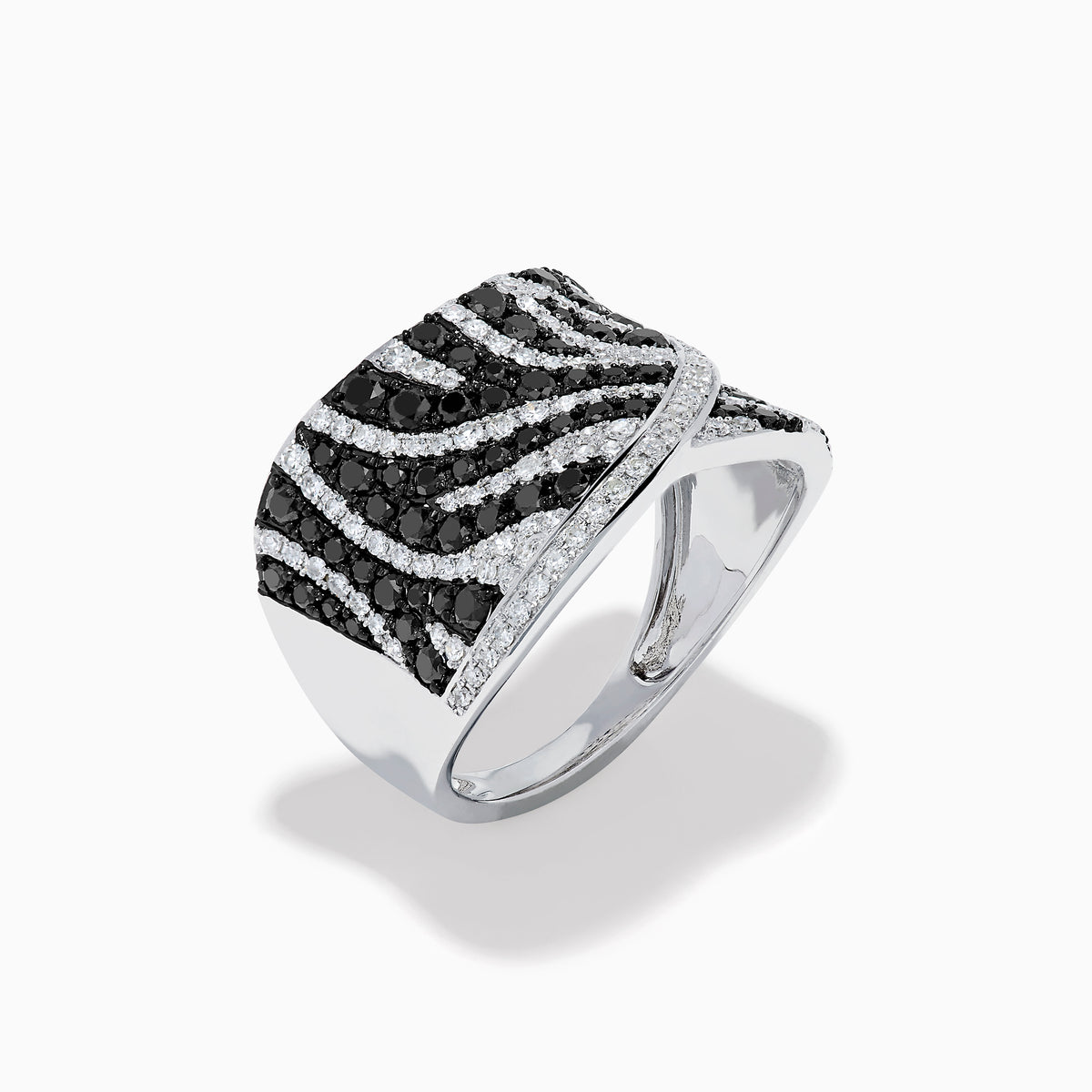 The 14K White Gold Black and White Diamond Zebra Print Ring features a wide, curved band with a striking black and white diamond stripe pattern set in sparkling white gold.