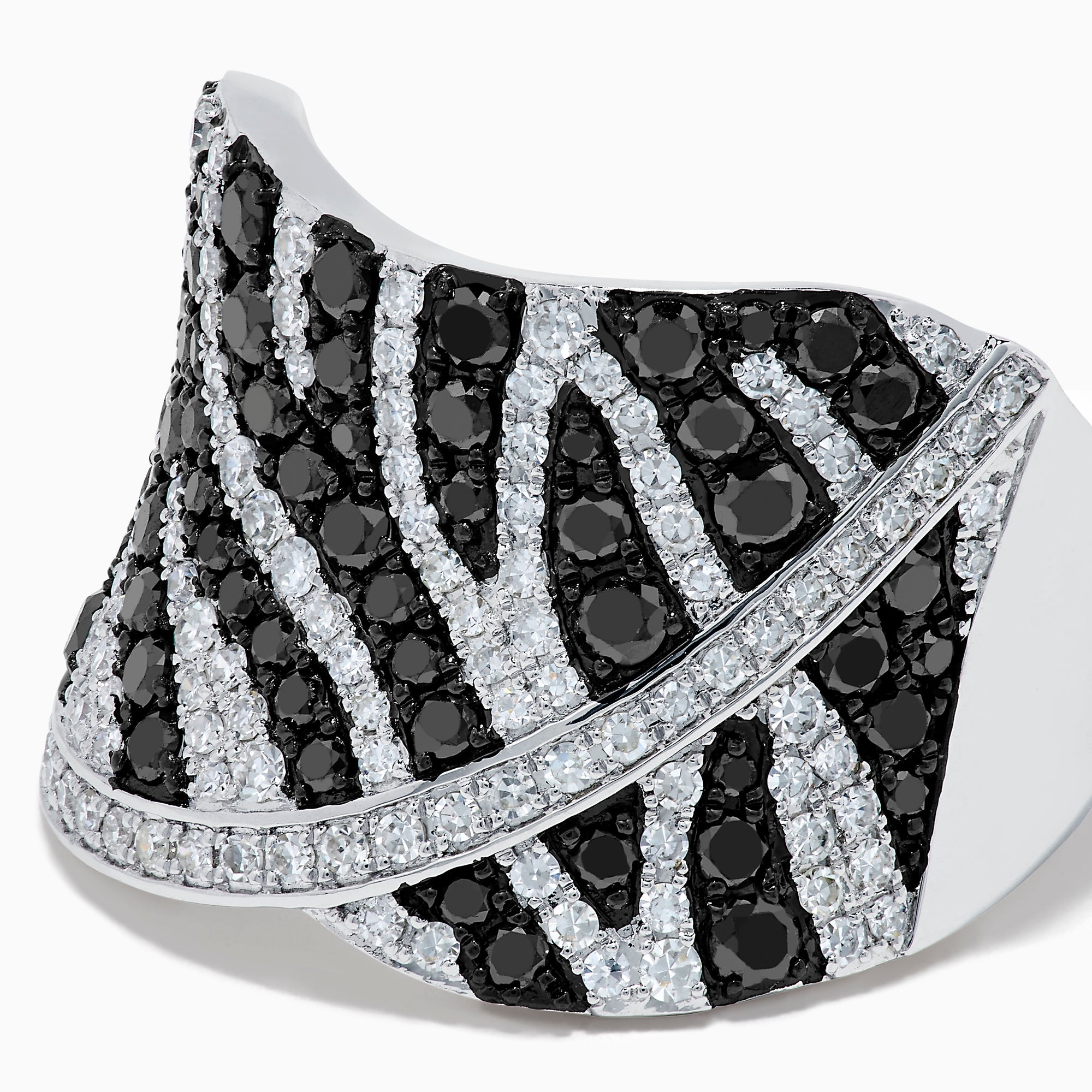 The 14K White Gold Black and White Diamond Zebra Print Ring features a wide, curved band with a striking black and white diamond stripe pattern set in sparkling white gold.