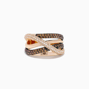 The 14K Rose Gold Brown and White Diamond Crossover Ring showcases interwoven bands accented with sparkling white diamonds and rich brown gemstones, creating a stunning layered and elegant look.
