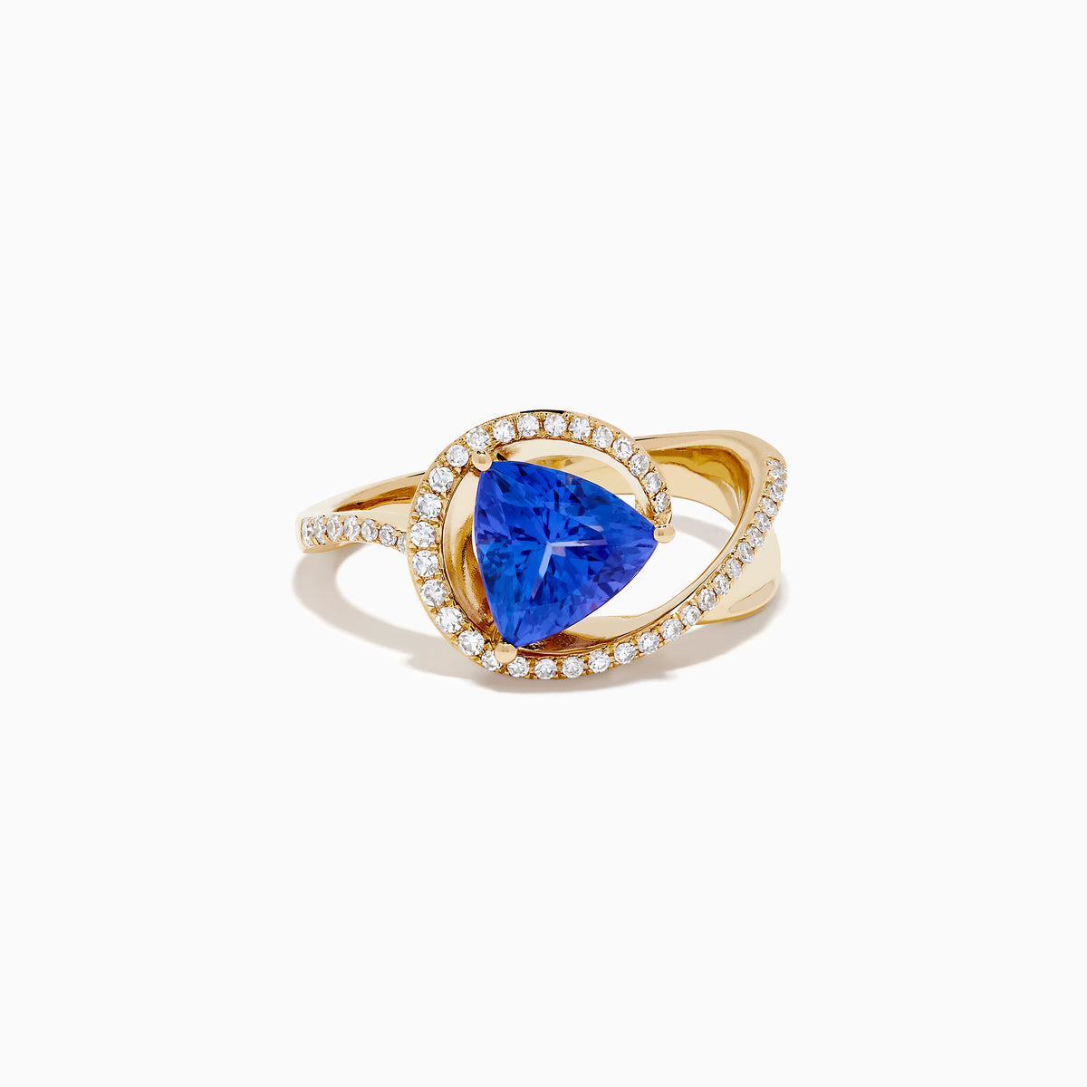 The 14K Yellow Gold Trillion Tanzanite and Diamond Swirl Ring showcases a triangular blue tanzanite center framed by a swirl of white diamonds, all set against a plain white background.