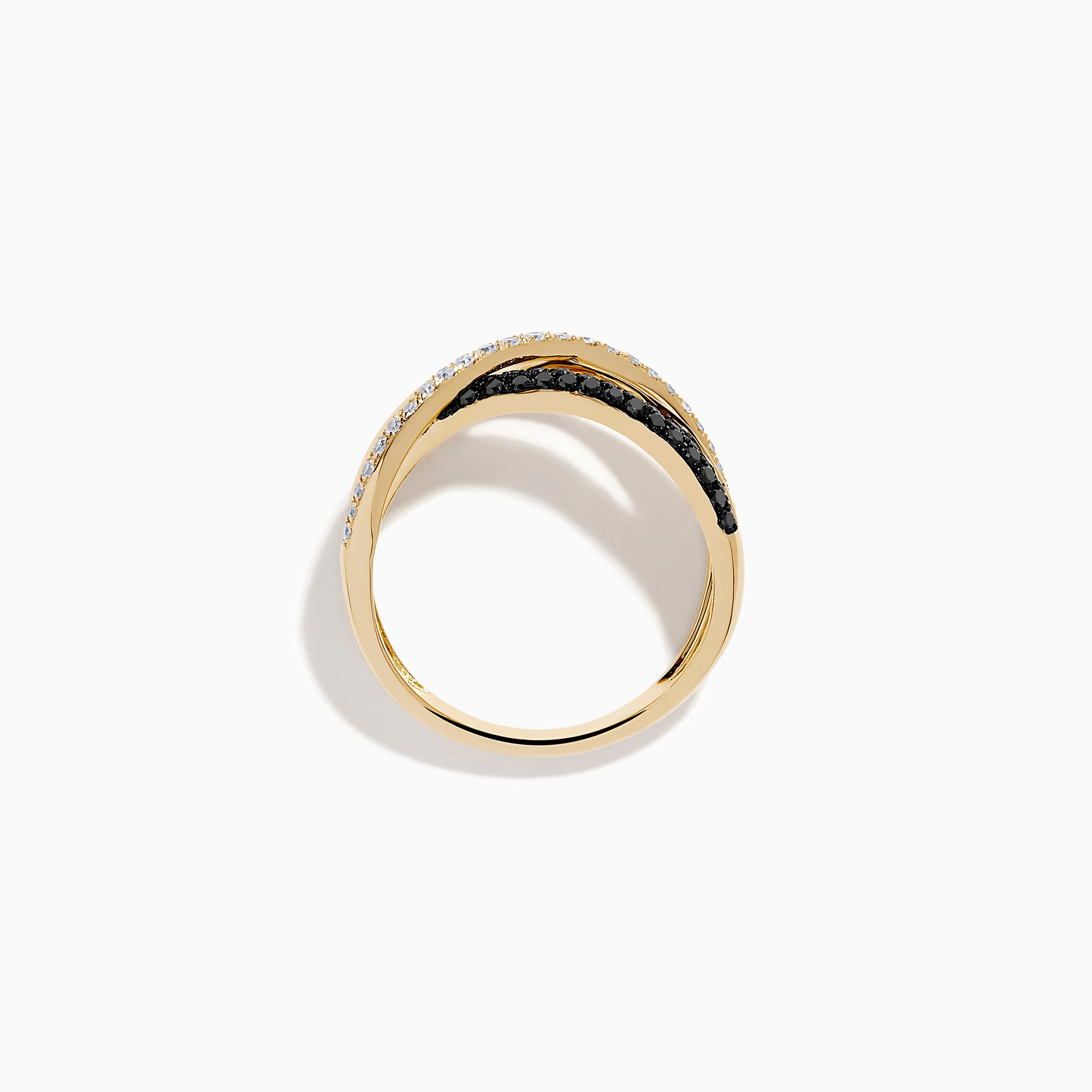 The 14K Yellow Gold Black and White Diamond Crossover Ring features three intertwined bands: a polished gold band, a black and white diamond band, and a clear diamond wave-patterned band.