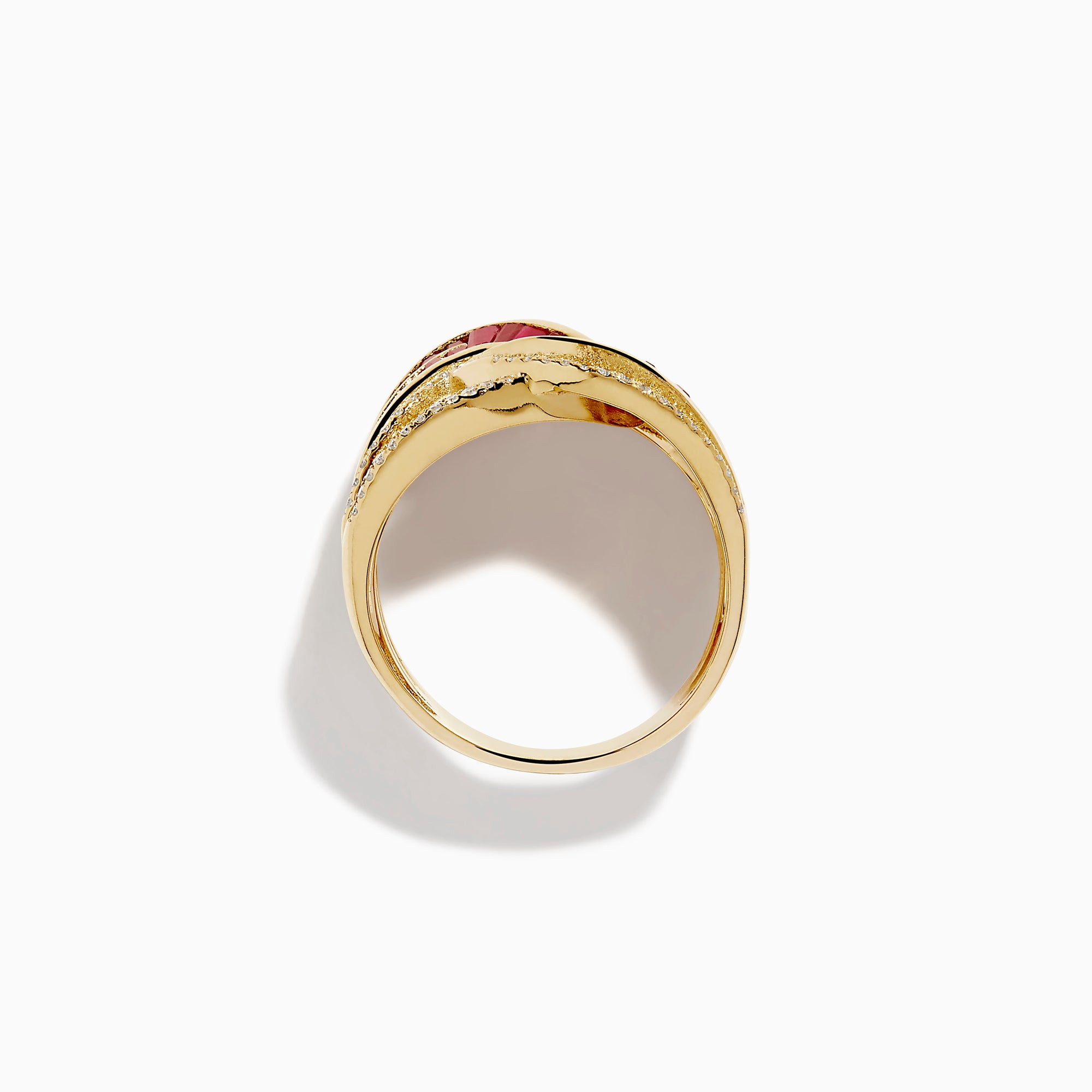 The 14K Yellow Gold Ruby and Diamond Crossover Ring showcases interwoven rows of rectangular red rubies and round white diamonds in a wavy, braided design across the band.