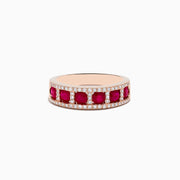 The Ruby Royale 14K Rose Gold Ruby and Diamond Band features five round rubies separated by vertical rows of diamonds, with extra diamonds lining the top and bottom edges for a dazzling effect.