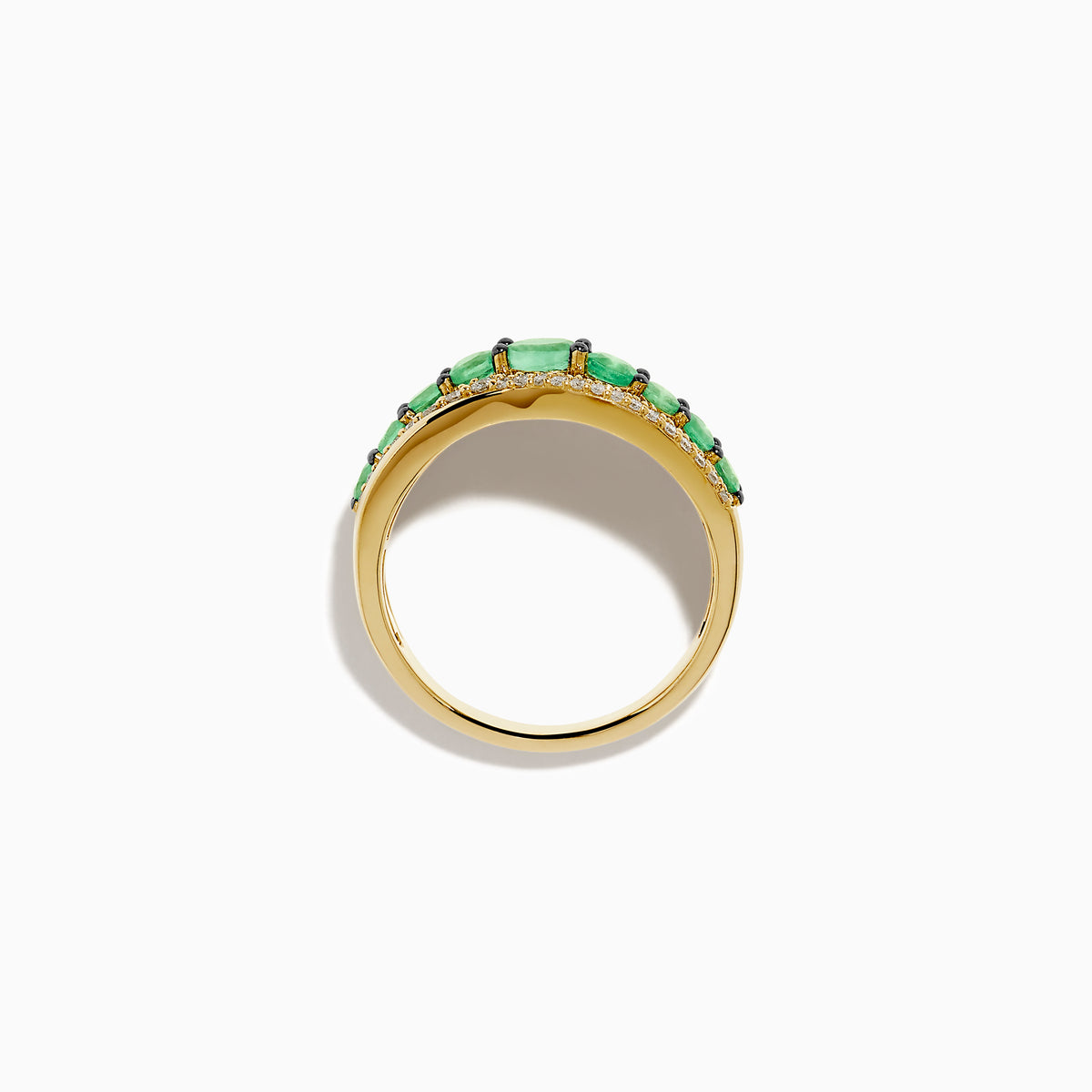 The 14K Yellow Gold Emerald and Diamond Wave Band features a central row of green emeralds bordered by two wavy rows of sparkling white diamonds in an elegant overlapping design.