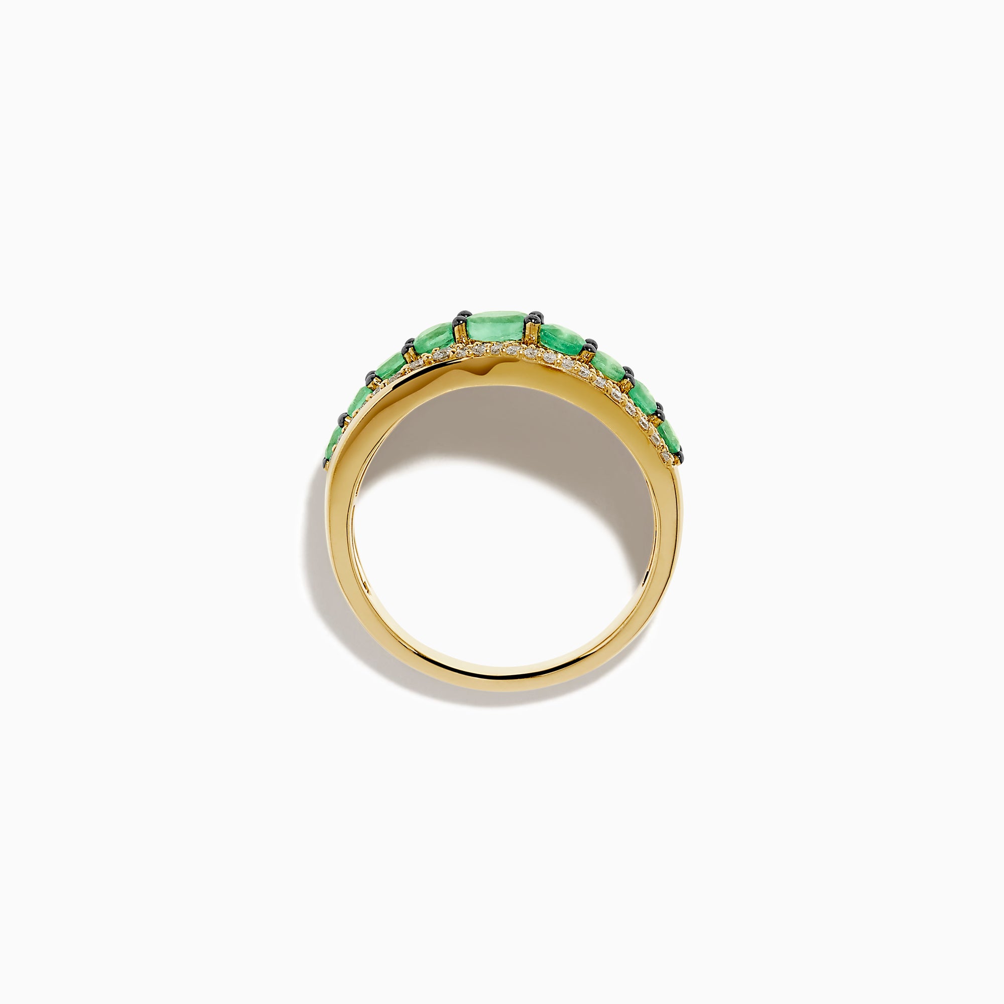 The 14K Yellow Gold Emerald and Diamond Wave Band features a central row of green emeralds bordered by two wavy rows of sparkling white diamonds in an elegant overlapping design.