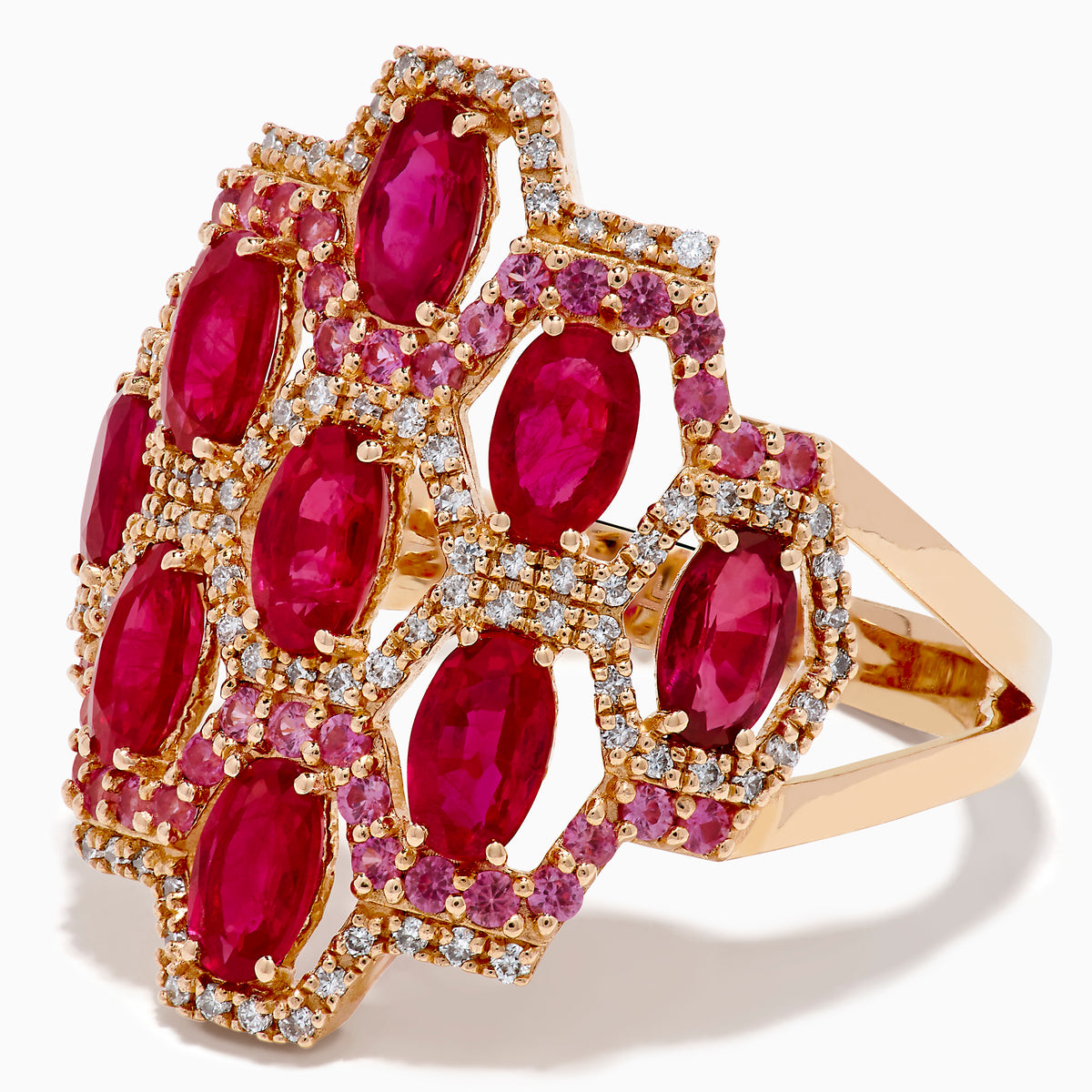 The 14K Rose Gold Ruby, Pink Sapphire, and Diamond Statement Ring showcases a geometric honeycomb design with oval red gemstones and sparkling diamonds, beautifully displayed on a white background.