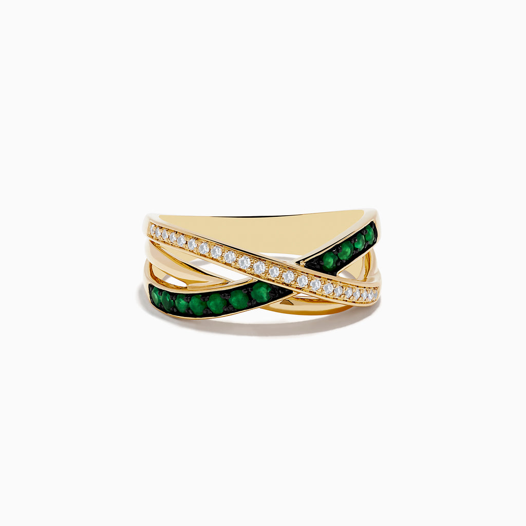 The 14K Yellow Gold Emerald and Diamond Crossover Band features crisscrossing bands—one adorned with sparkling diamonds, the other with vivid emeralds—for an elegant, modern look.