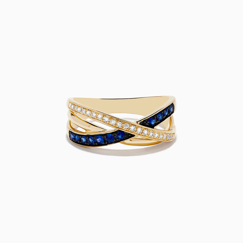 The Royale Bleu 14K Yellow Gold Blue Sapphire and Diamond Crossover Ring features two overlapping bands: one set with diamonds, the other adorned with vivid blue sapphires.