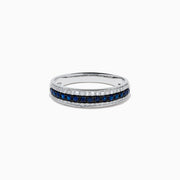 The 14K White Gold Pave Blue Sapphire and Diamond Band features a central row of blue sapphires bordered by sparkling diamonds, displayed on a plain white background.