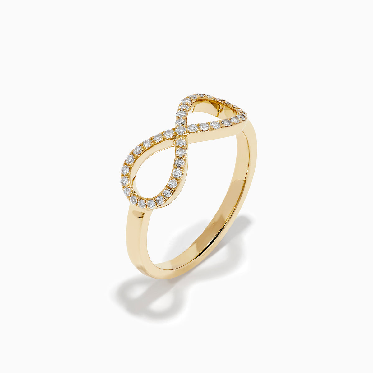 The 14K Yellow Gold Diamond Infinity Pinky Ring features an infinity symbol encrusted with small diamonds, creating a stunning statement piece against a plain white background.